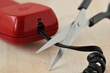 scissors-cutting-telephone-cord-concept-600nw-1406294522.jpg